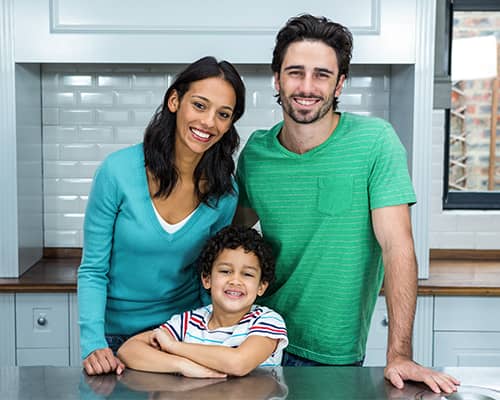 Happy Family in Their New Home Kitchen in New Hampshire